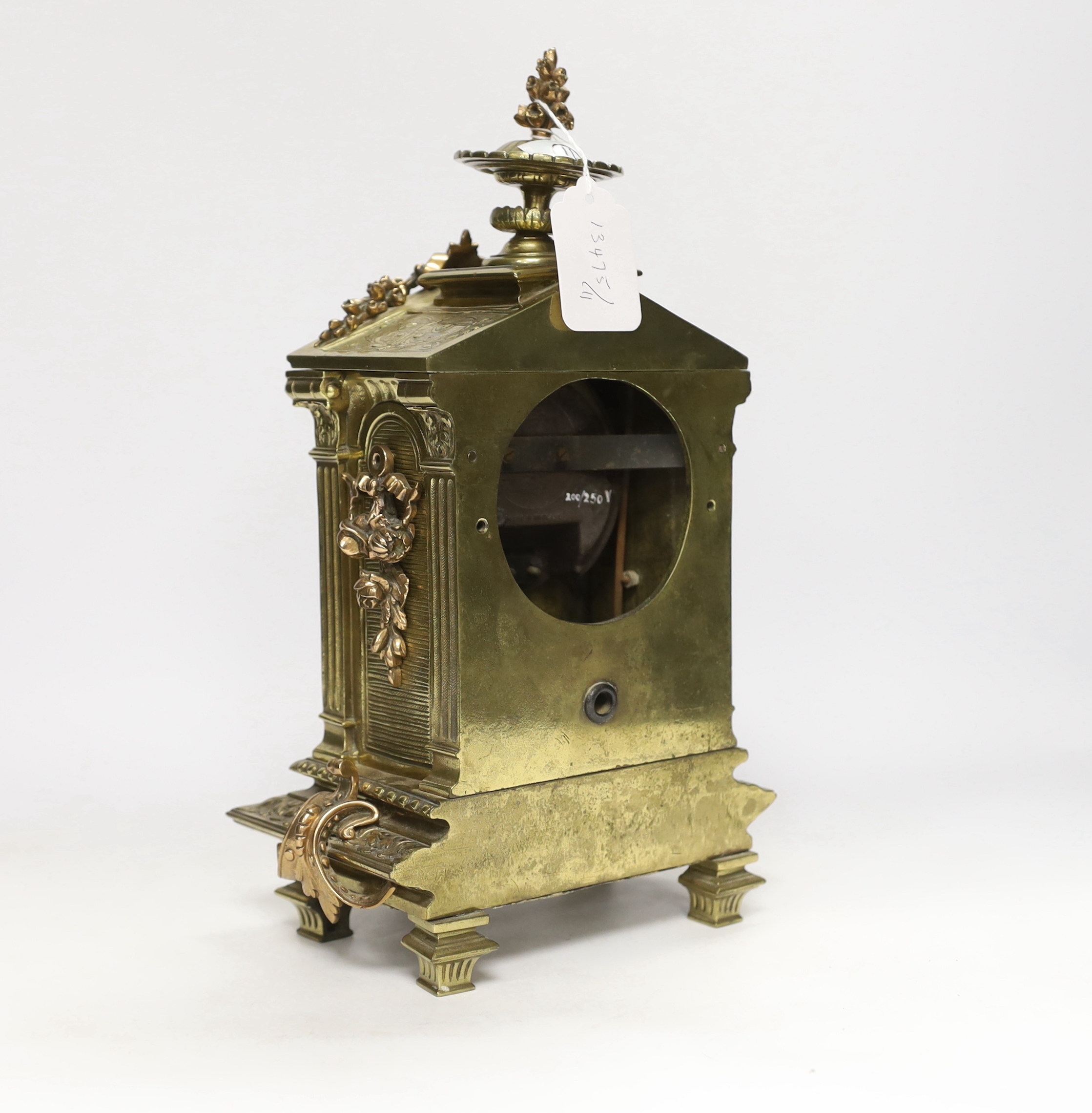 A 20th century French brass and bronze mantel clock, adapted to electric, 34cm